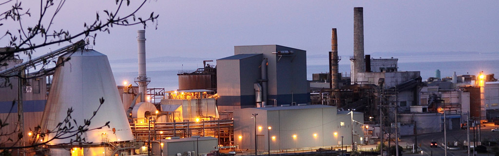 Manufacturing facility next to a body of water