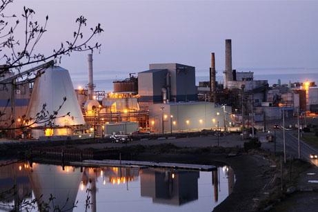 Manufacturing facility next to a body of water
