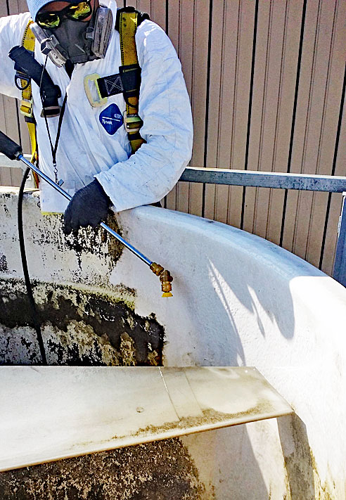 Clarity HVAC Services Team cleaning a cooling tower