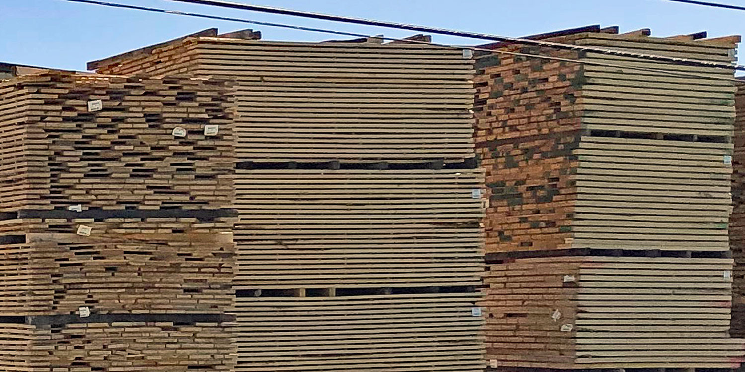Stacks of kiln-dried lumber at a kiln-drying lumber mill
