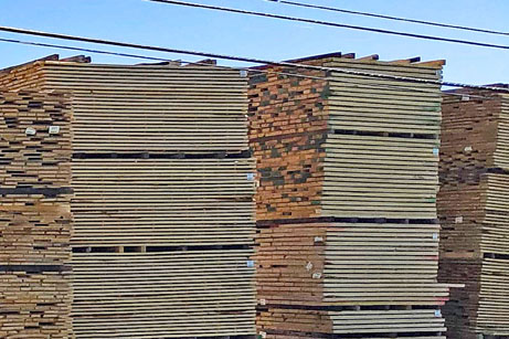 Stacks of kiln-dried lumber at a kiln-drying lumber mill