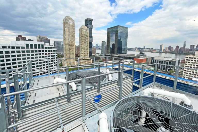 cooling towers on a city rooftop