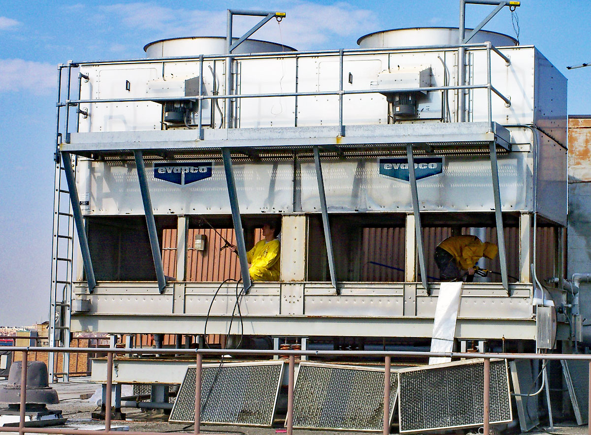 Two members of the Clarity Service Team cleaning a cooling tower