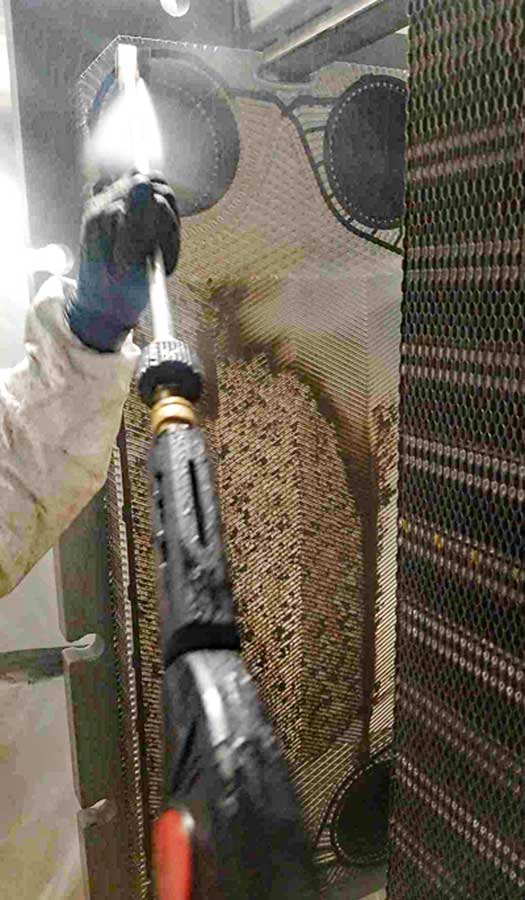 Clarity Services Team cleaning a cooling tower